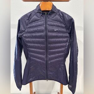 Nike running jacket purple medium down in front and back panel.‎ Water repellent